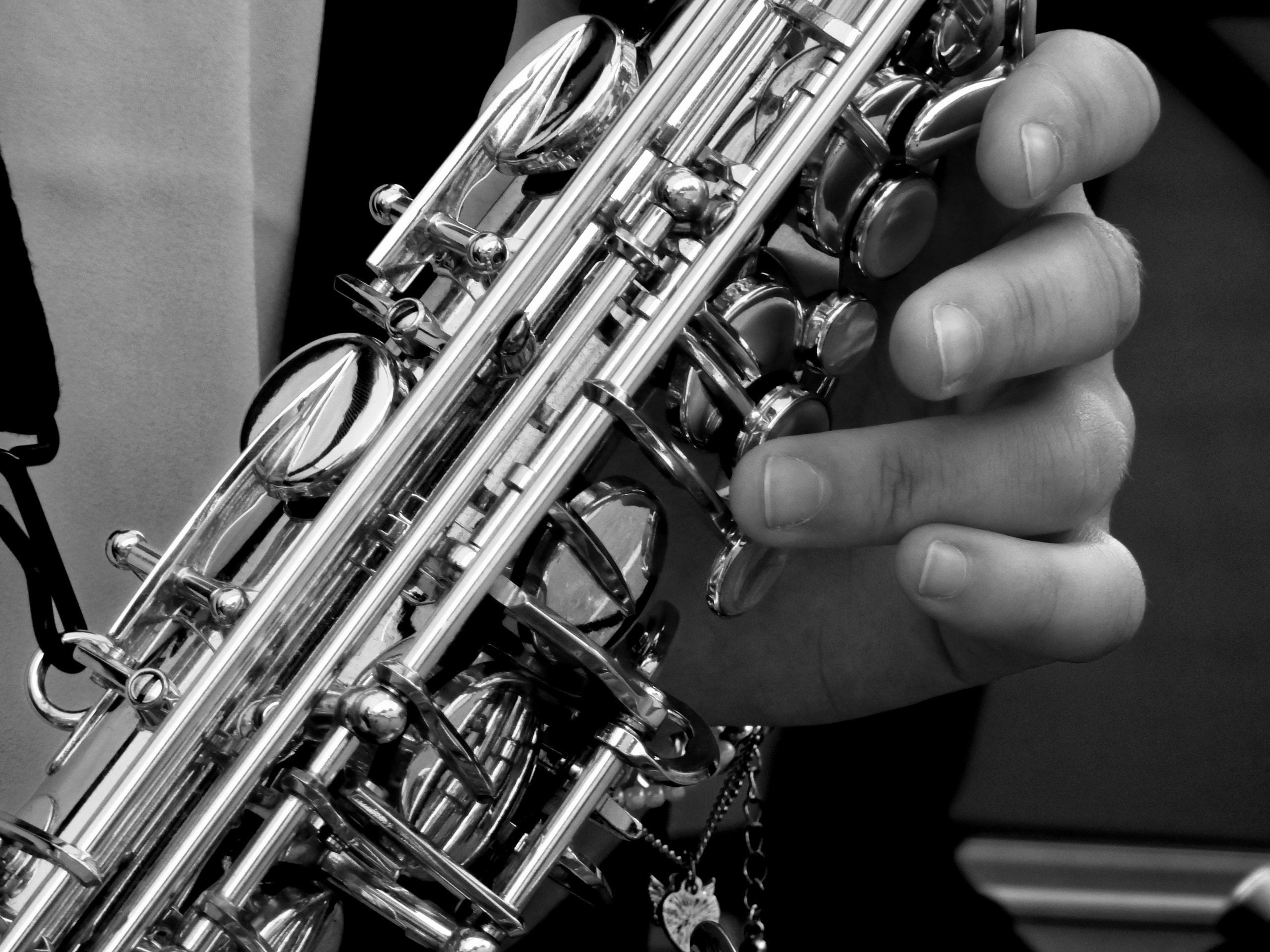 Fingers on a saxophone playing music